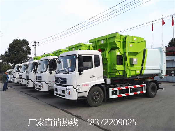 7臺(tái)東風(fēng)天錦勾臂式垃圾車搭載7個(gè)10方移動(dòng)垃圾壓縮箱出發(fā)前往山西
