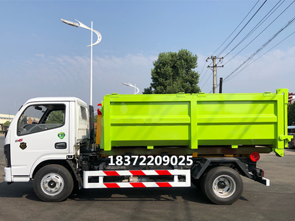 國六東風(fēng)多利卡D6勾臂式垃圾車向特區(qū)問好